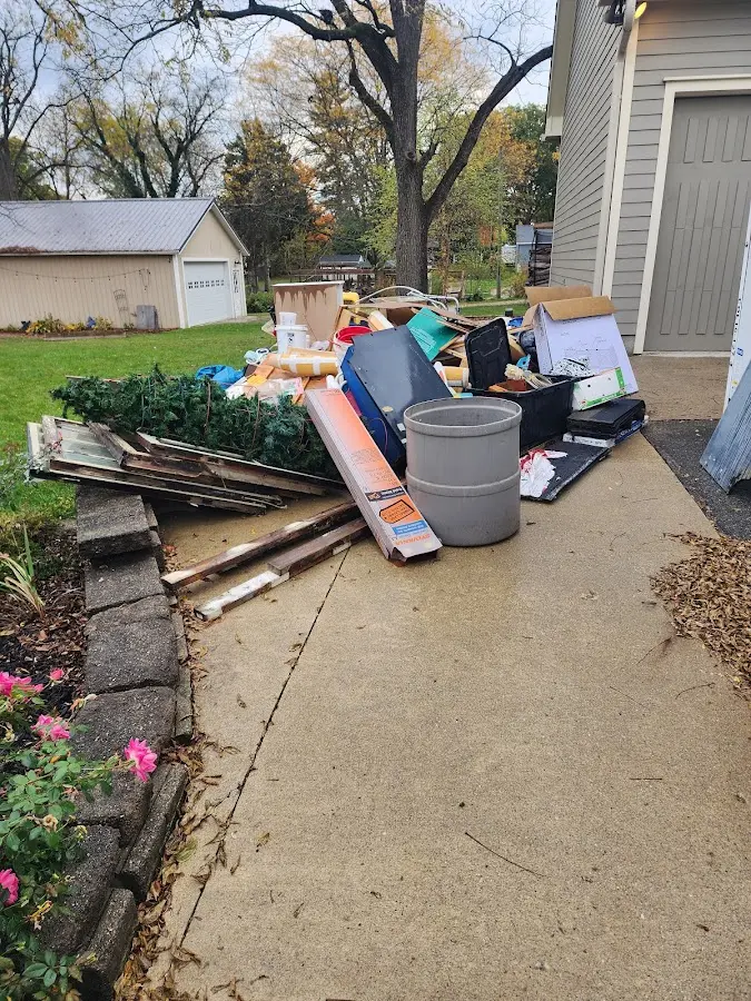Dumpster being loaded with debris for 10 Yard Dumpster Rental in Granite Hills